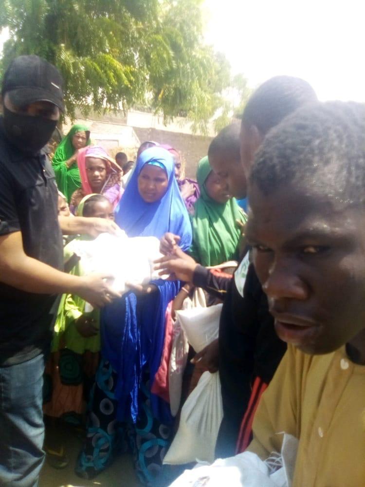 Community members receiving assistance from Dar Al Ayetam Charity Foundation in Nigeria
